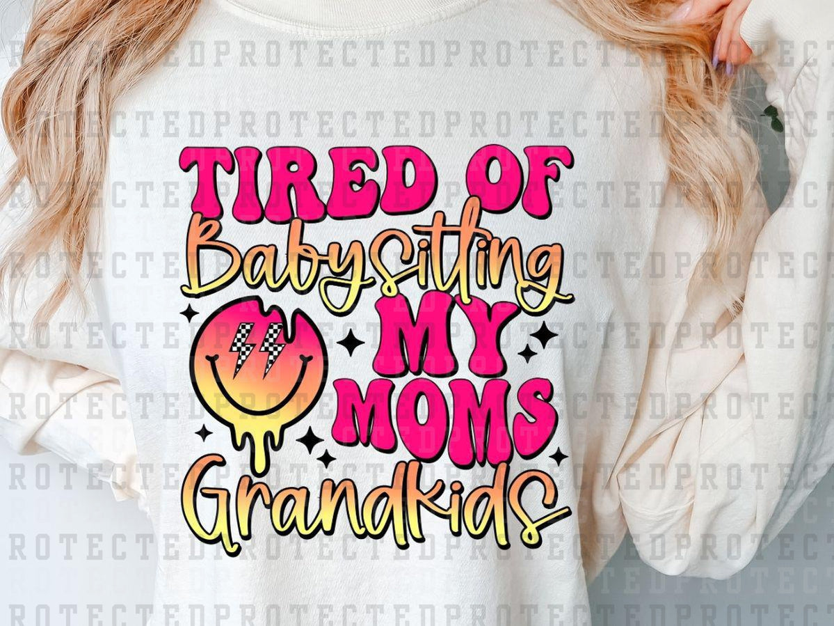 TIRED OF BABYSITTING MY MOMS GRANDKIDS - PINK/YELLOW - MELTING SMILEY - DTF TRANSFER